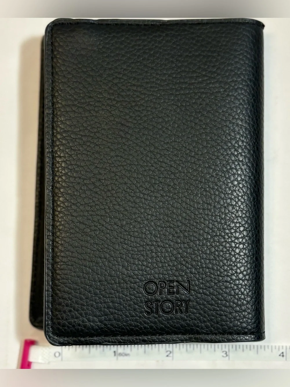 Open Story black pebble leather passport holder or travel wallet